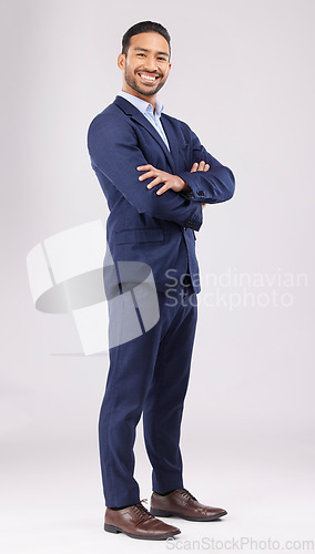 Image of Portrait, business and asian man in studio with arms crossed for professional style of financial advisor trading in suit on white background. Happy entrepreneur, confident trader or corporate fashion