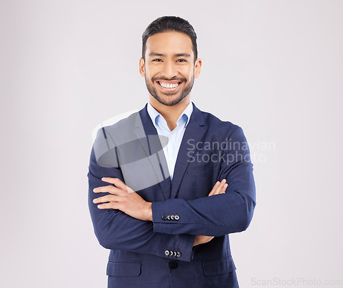 Image of Happy business man, arms crossed and studio portrait with pride, success and suit by white background. Young asian entrepreneur, smile and excited for finance company, corporate career and ambition