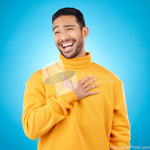 Image of Young man, ego and pride in studio, with choice of me and comic laugh with trendy clothes by blue background. Funny gen z person, fashion model or happy student with smile after joke with self love