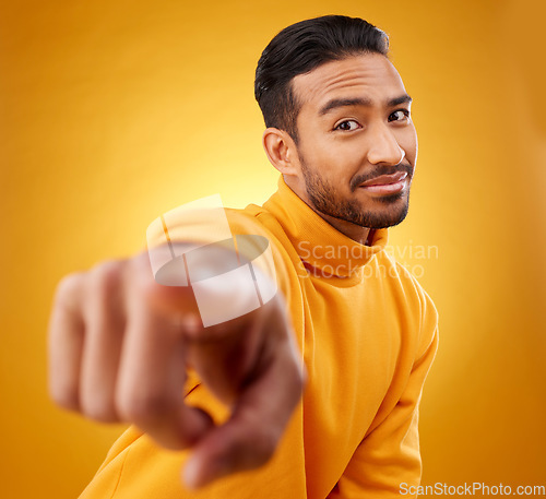 Image of Portrait, asian man and hand pointing in studio with you, sign or thank you gesture on yellow background. Face, finger and Japanese male model with selection, choice or decision, vote or attention