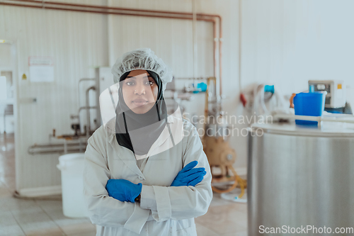 Image of Arab business woman visiting a cheese factory. The concept of investing in small businesses