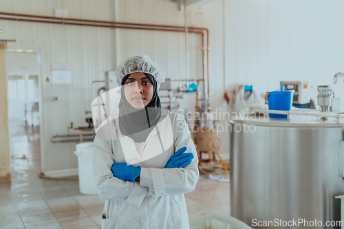 Image of Arab business woman visiting a cheese factory. The concept of investing in small businesses