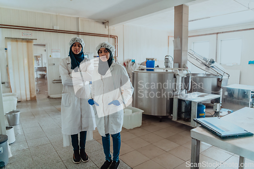 Image of Arab business partner visiting a cheese factory. The concept of investing in small businesses