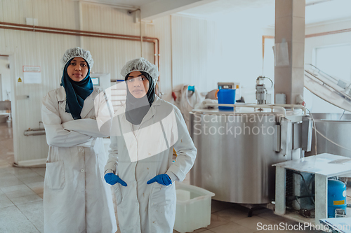 Image of Arab business partner visiting a cheese factory. The concept of investing in small businesses