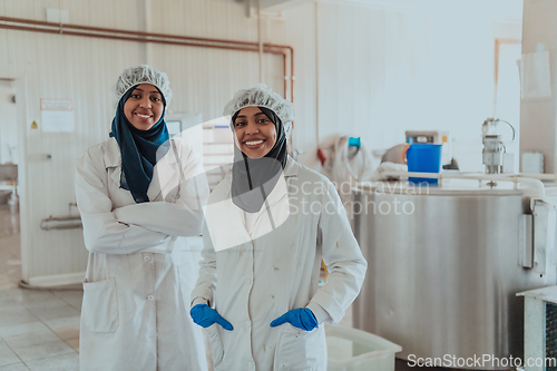 Image of Arab business partner visiting a cheese factory. The concept of investing in small businesses