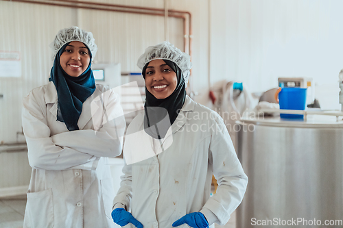 Image of Arab business partner visiting a cheese factory. The concept of investing in small businesses