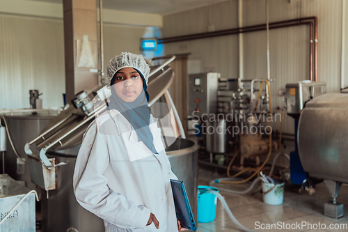 Image of Arab business partner visiting a cheese factory. The concept of investing in small businesses