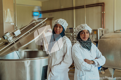 Image of Arab business partner visiting a cheese factory. The concept of investing in small businesses