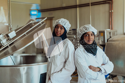 Image of Arab business partner visiting a cheese factory. The concept of investing in small businesses