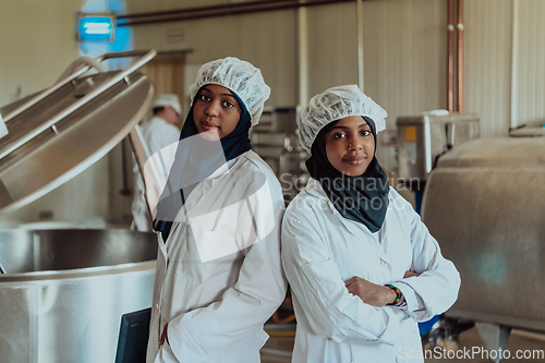 Image of Arab business partner visiting a cheese factory. The concept of investing in small businesses