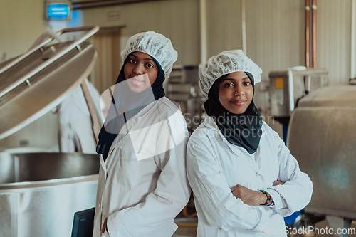 Image of Arab business partner visiting a cheese factory. The concept of investing in small businesses