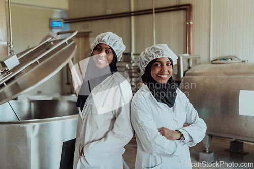 Image of Arab business partner visiting a cheese factory. The concept of investing in small businesses