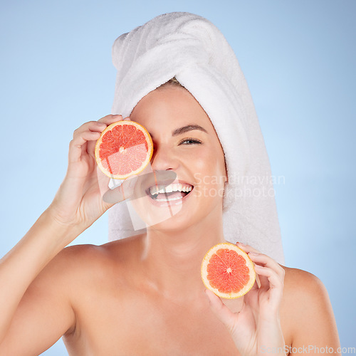 Image of Grapefruit, beauty and portrait of happy woman in studio, vitamin c nutrition or natural glow. Female model, healthy skincare and laugh with citrus fruits in shower cosmetics, eco dermatology or diet