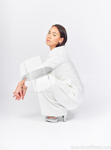 Image of Business, suit and portrait of a woman on a studio background with confidence and class. Stylish, fashion and a young Asian model or girl in clothes for work isolated on a backdrop for corporate