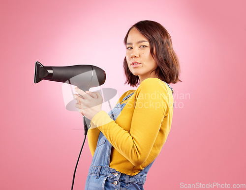 Image of Hairdryer, salon and beauty with portrait of woman in studio for hairdresser, hair care and cosmetic. Shampoo, spa and hairstyle with face of asian person on pink background for product and treatment