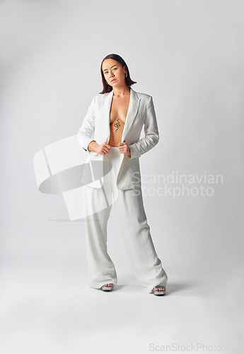 Image of Portrait, suit and fashion with asian woman with style or full body in studio or white background with cool outfit. Girl, retro and trendy or luxury or vintage clothes with smart casual person.