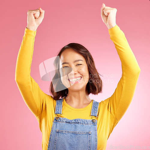 Image of Smile, celebration and success with portrait of woman in studio for party, winner and motivation. Wow, freedom and prize with face of person cheering in pink background for yes, bonus and excited