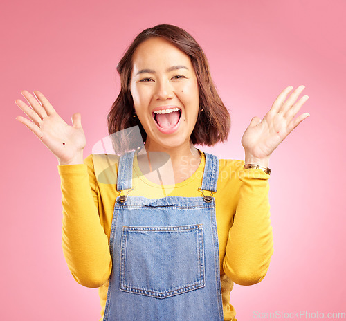 Image of Happy, celebration and surprise with portrait of woman in studio for party, winner and motivation. Wow, freedom and prize with face of person cheering in pink background for yes, bonus and excited