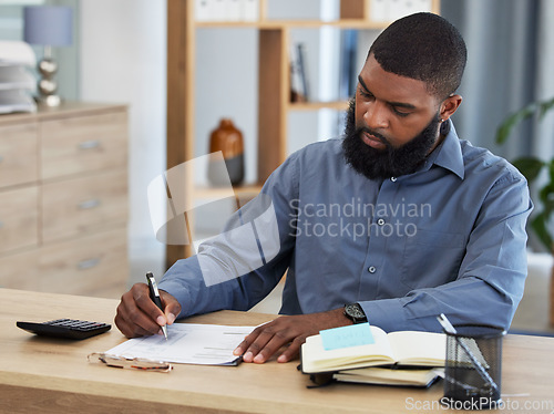 Image of Black man, planning finance or working on budget in home or remote work, accounting or writing on documents or paper. Tax, audit or businessman in office with financial strategy or accountant