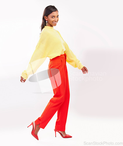 Image of Happy, fashion and Indian woman with pose in studio with confidence, happiness and pride. Professional, business and portrait of female person in trendy clothes, style and outfit on white background