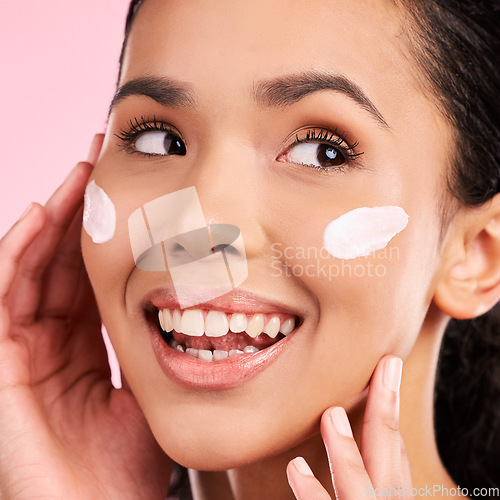 Image of Cream, beauty and face of a happy woman with skin care, dermatology and natural glow. Headshot of a young female aesthetic model with a smile for moisturizer, cosmetics or sunscreen in studio