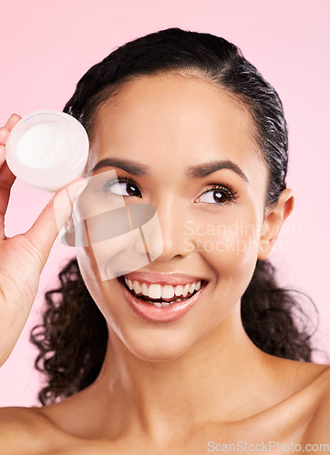 Image of Skincare, happy and woman with cream jar in studio isolated on a pink background. Smile, beauty and natural model with moisturizer container, sunscreen cosmetic and dermatology product for wellness