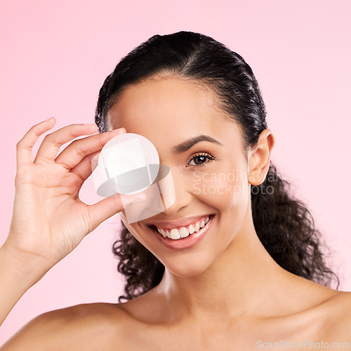 Image of Face, skincare and happy woman with cream container in studio isolated on a pink background. Portrait, beauty and model smile with moisturizer, sunscreen cosmetic or dermatology product for wellness
