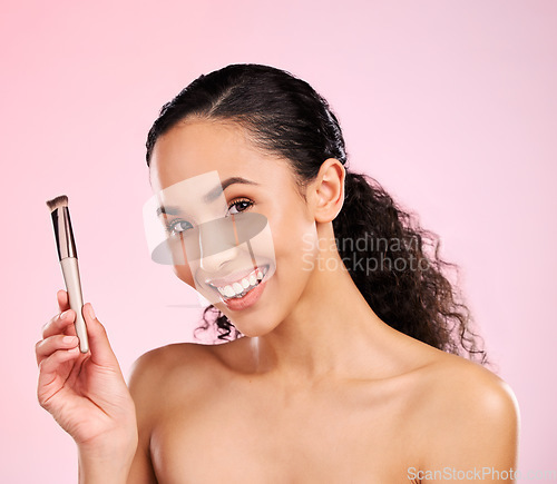 Image of Beauty, makeup and brush with portrait of woman in studio for foundation, cosmetics and facial. Skincare, health and self care with face of model on pink background for dermatology, glow and product