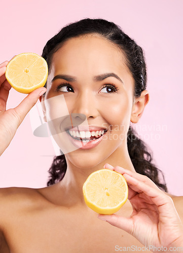 Image of Skincare, lemon and woman thinking of beauty, cosmetics and natural product or vitamin c benefits. Happy african person or model with fruits ideas for skin care dermatology on pink, studio background