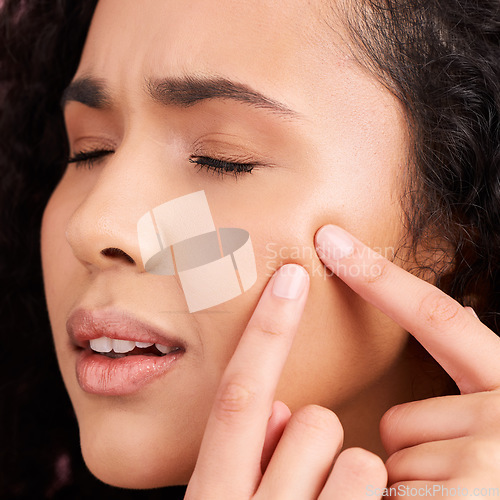 Image of Acne, woman and skincare with squeeze pimple for problem with dermatology in pink or studio background. Natural face, girl and blackhead with cosmetic treatment for facial or wellness and self care.