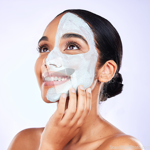 Image of Smile, face mask and woman in studio with skincare, results and dermatology wellness on grey background. Facial, comparison and female with half beauty, routine and clay product for skin exfoliation