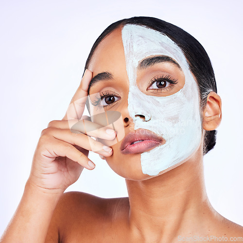 Image of Portrait, skincare and woman in studio with facial, half and cosmetic treatment on grey background. Face, mask and and female wellness model with cream, comparison or result, beauty and satisfaction