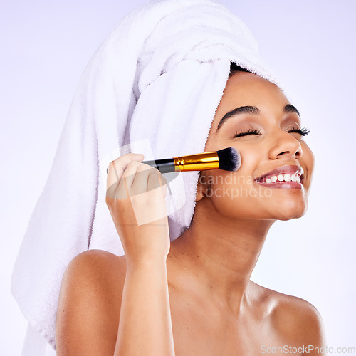 Image of Beauty, smile and Indian woman with makeup brush studio for glamour, cosmetics and application on grey background. Happy, tools and female model with cheek, powder or foundation, self love or results