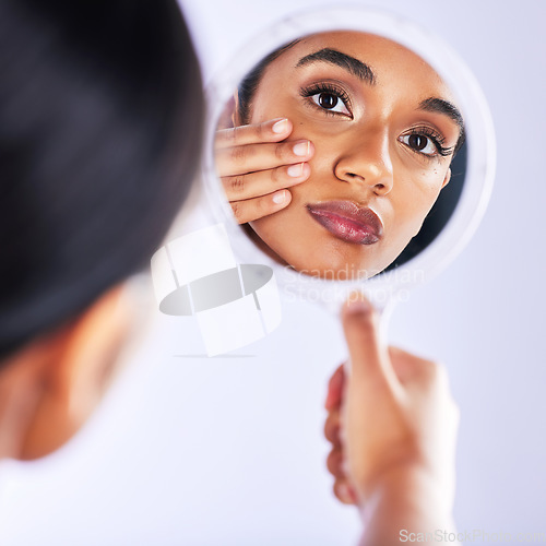 Image of Studio, skincare and portrait of woman with mirror for skin, check or facial results on grey background. Beauty, reflection and female model with cosmetic, inspection and dermatology wellness routine