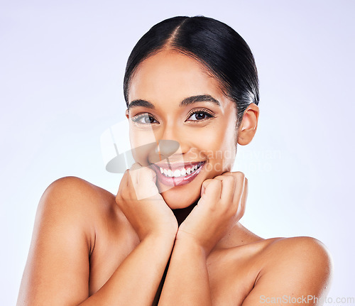 Image of Portrait, smile and skincare with a model woman in studio on a gray background for natural wellness. Face, beauty and aesthetic with a happy young person posing for luxury cosmetics or dermatology