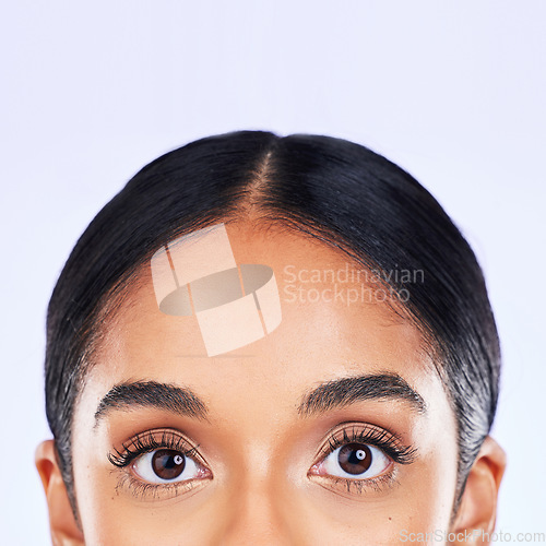 Image of Beauty, eyes and portrait of woman in studio with cosmetics, lashes and mascara on white background. Eyelash care, vision and eye makeup, closeup of skincare model with skin glow and luxury eyeliner.