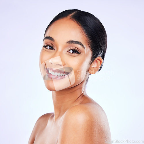 Image of Portrait, beauty and smile with a model woman in studio on a gray background for natural wellness. Face, skincare and aesthetic with a happy young person posing for luxury cosmetics or dermatology