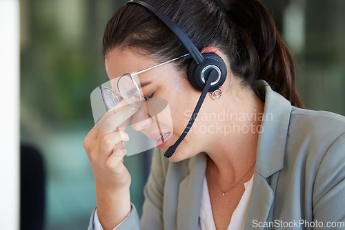 Image of Customer support, call center burnout or business woman stress over help desk mistake, networking problem or crisis. Mental health, telemarketing fail and depressed insurance agent with headache pain