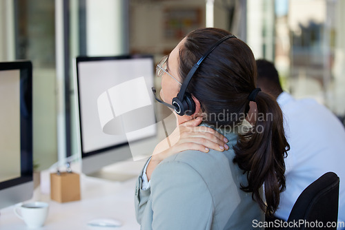 Image of Stress, woman and telemarketing with neck pain, call center or muscle tension with help. Female person, health issue and agent overworked, burnout or tech support with joint injury or posture problem