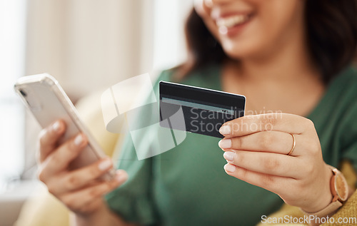 Image of Phone, credit card closeup and woman hands with online shopping and banking at home. Ecommerce, mobile cashback and sale with digital payment and easy pay with discount and smile from web checkout