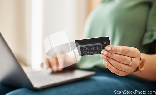Image of Laptop, credit card and woman hands with online shopping and banking at home. Ecommerce, cashback and sale with digital payment on web and easy pay with plastic discount and website checkout