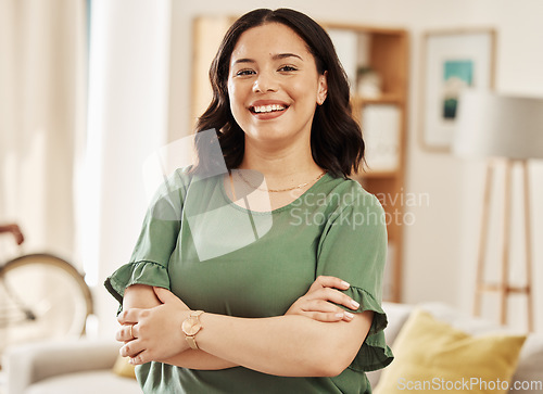 Image of Portrait, smile and woman in home with arms crossed, relax in good mood and me time in Colombia. Face of happy young female person in living room with confidence, freedom and enjoy break in apartment