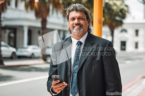 Image of Portrait, business and senior man with a smartphone, city and smile with connection, typing and social media. Face, male person outdoor and consultant with a cellphone, connectivity and mobile app