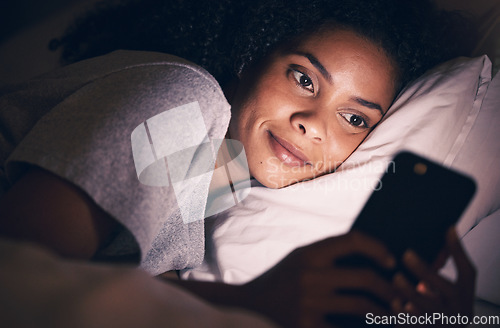 Image of Happy, night and phone with woman in bedroom for social media app, insomnia and networking. Communication, contact and internet with female person in bed at home for mobile, online and technology