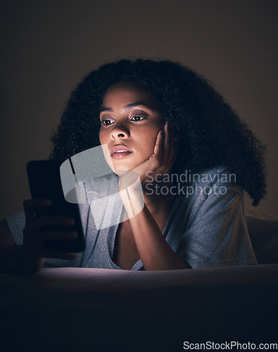 Image of Focus, night and phone with woman in bedroom for social media app, insomnia and networking. Communication, contact and internet with female person in bed at home for mobile, online and technology