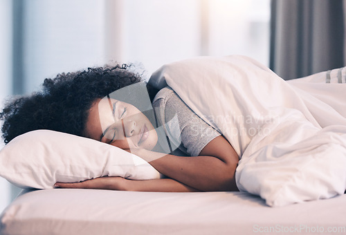 Image of Sleeping, woman and bed with nap at home in morning with rest feeling calm with peace. House, bedroom and tired female person relax and comfortable on a pillow with blanket dreaming over the weekend