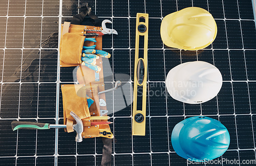 Image of Solar panel, tools and renewable energy isolated for maintenance and construction work. Above view, sustainability and engineer equipment on a rooftop for eco friendly power project and safety