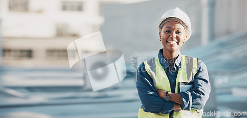 Image of Woman, construction worker and portrait with a smile for engineering and building renovation job. Arms crossed, happy and African female employee on a industrial site outdoor for builder project