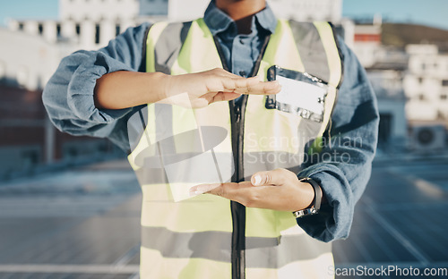 Image of Hands, construction and engineer on a roof for solar energy, building electric plant or electricity advertising. Sustainable marketing, gesture and a worker for electrician innovation and maintenance