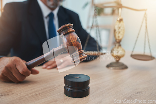 Image of Scale, judge and gavel with hands of man in office for lawyer, justice and legal hearing. Attorney hammer, advocate and crime with closeup of person law firm for courtroom, equality and jury decision